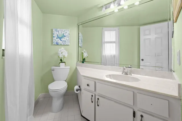 a front view of a house with a yard table and chairs