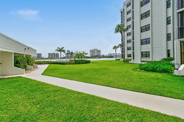 a living room with lots of chairs and a table