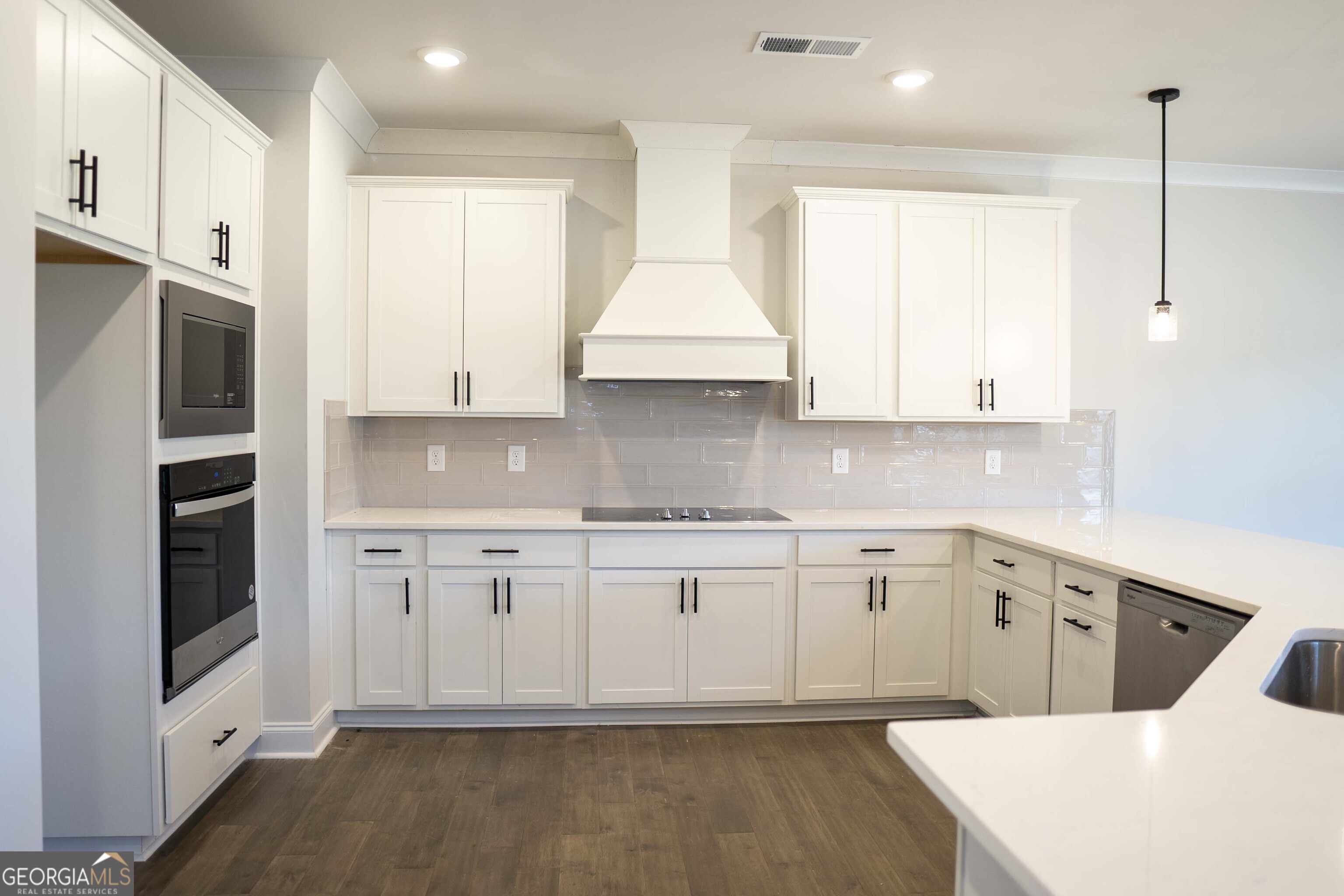 600 Beaver Court Perry, GA 31069 - Photo 16 of 48 a kitchen with stainless steel appliances granite countertop a stove a sink and a refrigerator