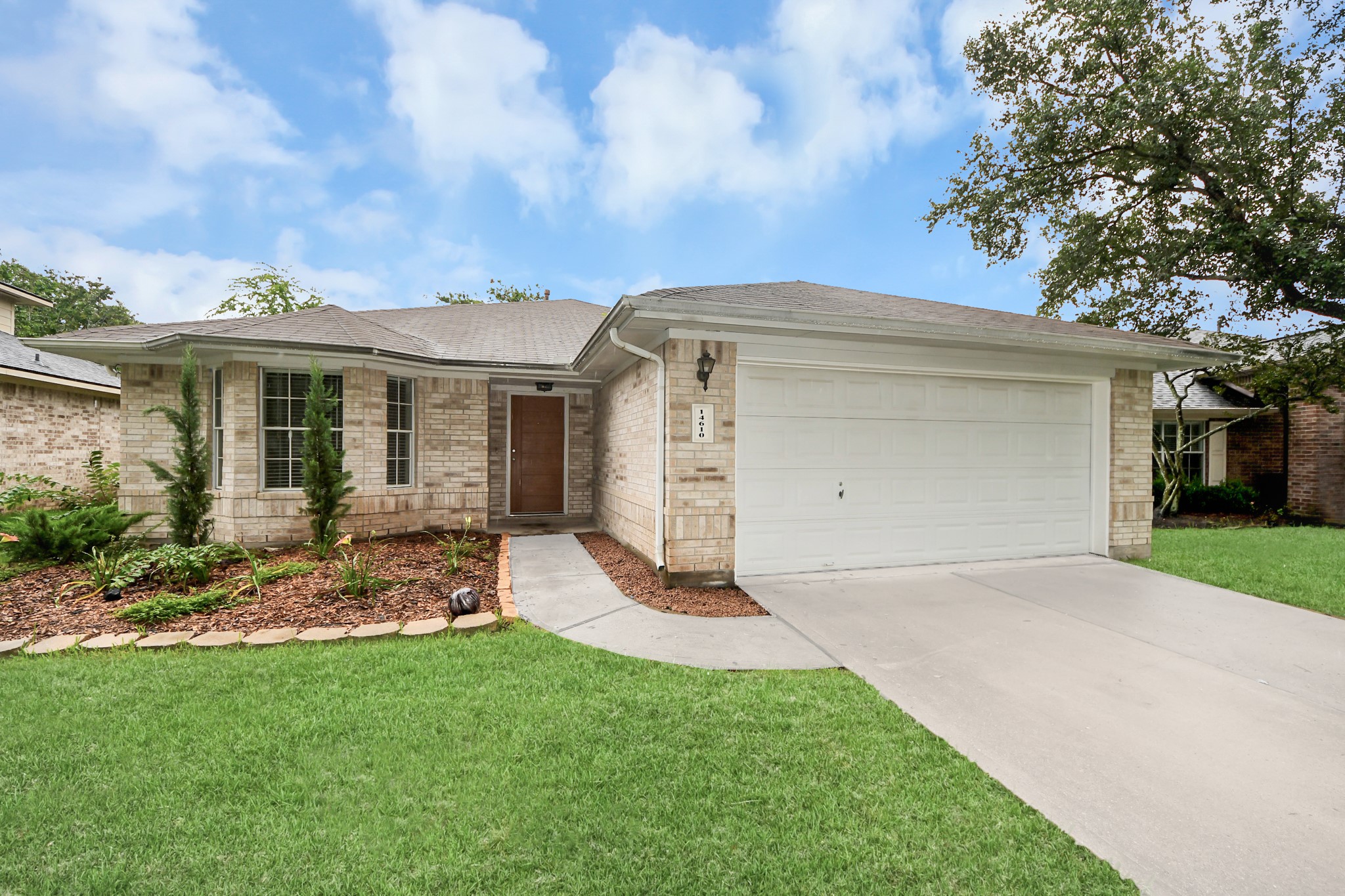 14610 Hazy Ridge Lane Cypress, TX 77429 - Photo 2 of 44 Beautiful curb appeal welcomes you home with an attractive exterior, well-maintained landscaping, and a spacious driveway. This inviting façade sets the stage for the exceptional living spaces and thoughtful upgrades found throughout the property.