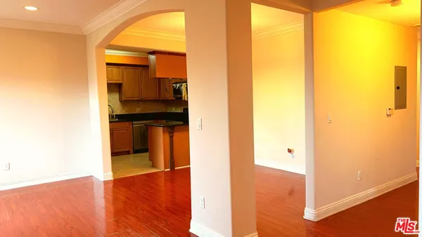 a view of a kitchen from a hallway