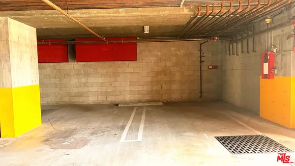 a view of a bathroom with a shower and a sink