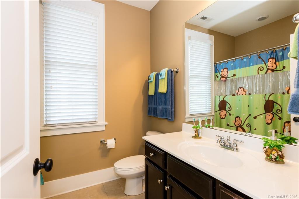 225 Coneflower Place, Unit 1405 Fort Mill, SC 29708 - Photo 20 of 22 a bathroom with a sink toilet and shower