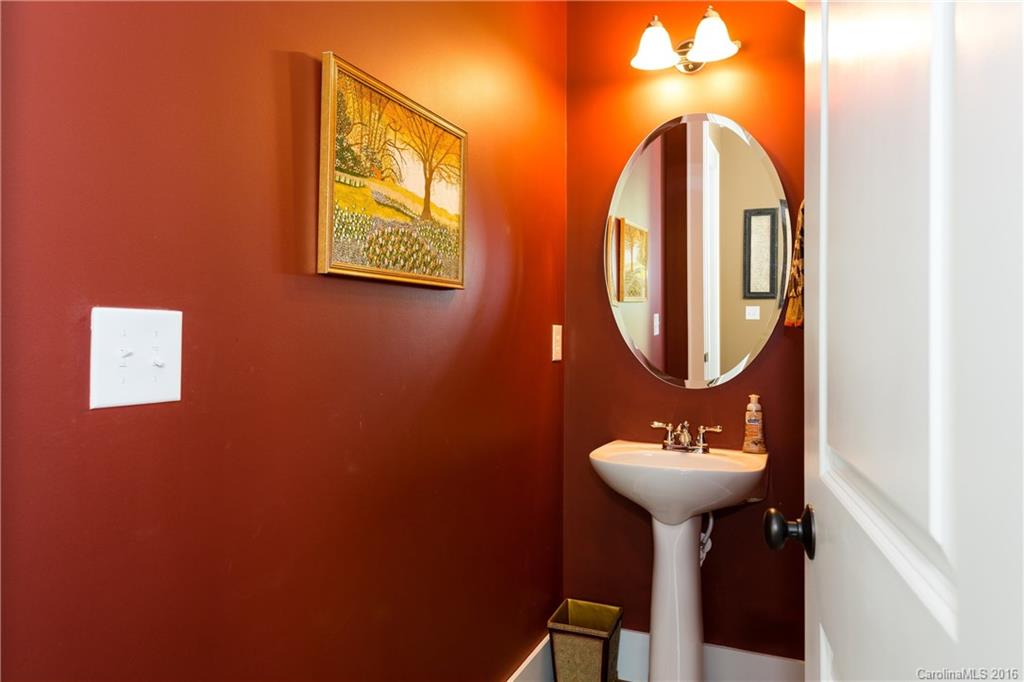 225 Coneflower Place, Unit 1405 Fort Mill, SC 29708 - Photo 8 of 22 a bathroom with a sink and a mirror