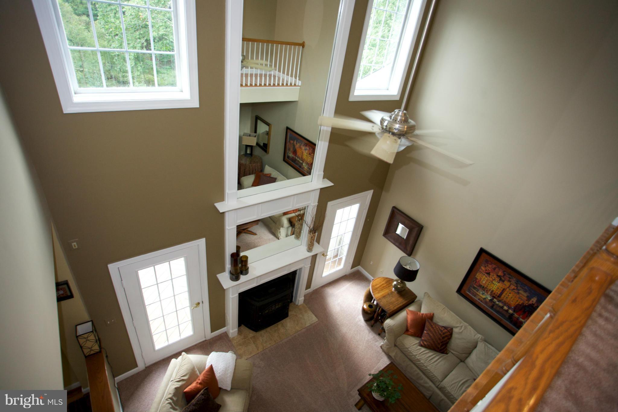 18687 Canby Road Leesburg, VA 20175 - Photo 16 of 30 Great room with two story mirror above FP