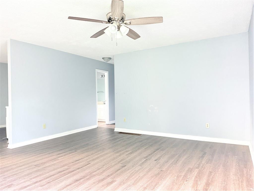 330 Peach Orchard Road Baldwin, GA 30531 - Photo 6 of 13 a view of an empty room with wooden floor