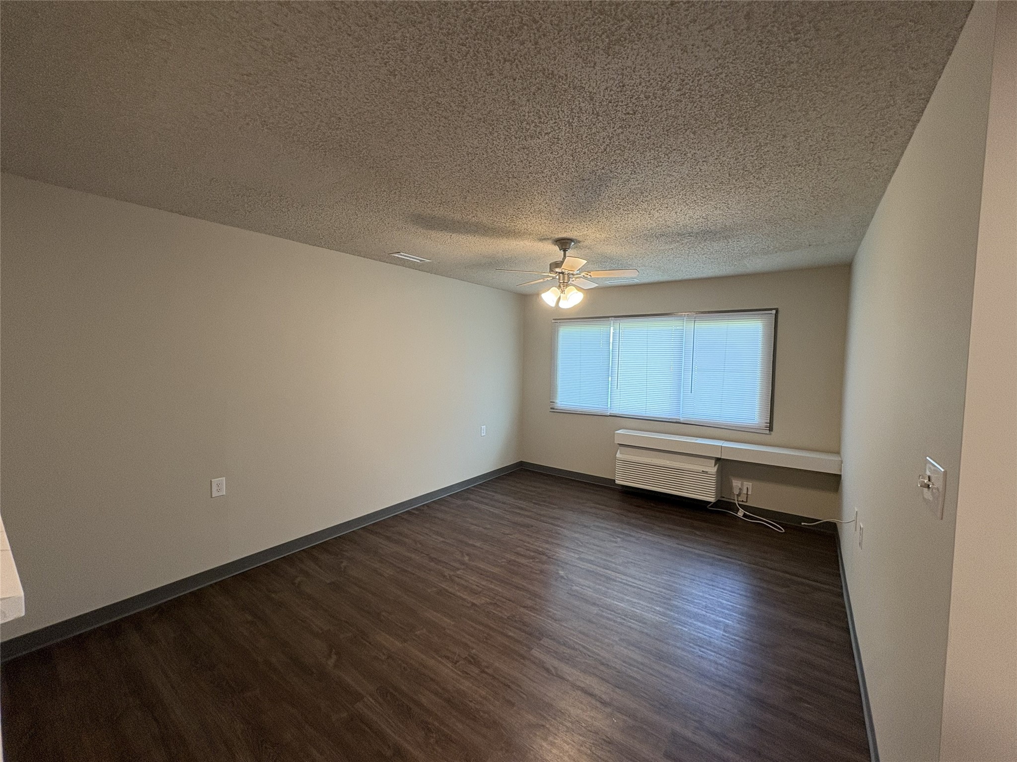 1700 Park Street Beatrice, NE 68310 - Photo 16 of 25 a view of an empty room with a window and wooden floor