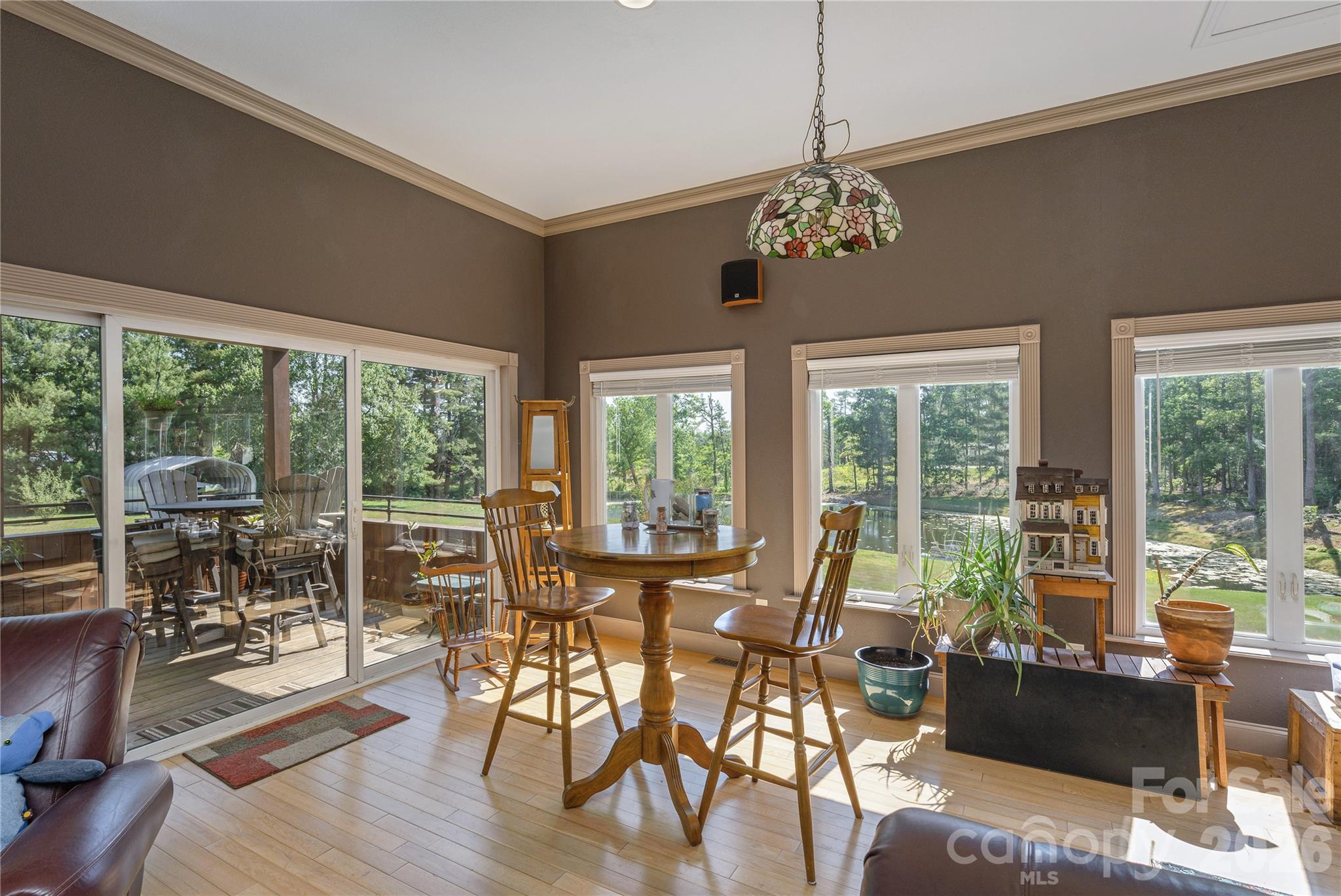 231 Allen Road East Flat Rock, NC 28726 - Photo 15 of 42 a view of a dining room with furniture window and outside view