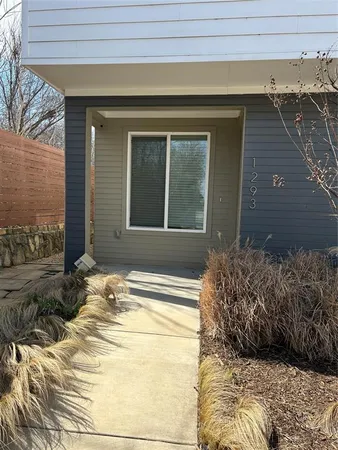 a view of a entryway door front of a house