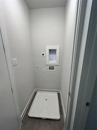 an entryway in a hall with wooden floor