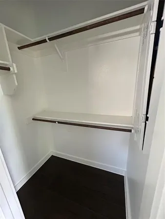 a bathroom with a toilet sink and a mirror