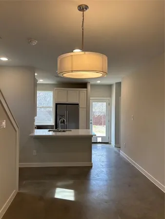 a view of a kitchen with a dishwasher and a fireplace
