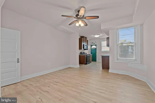 a view of an empty room with a window