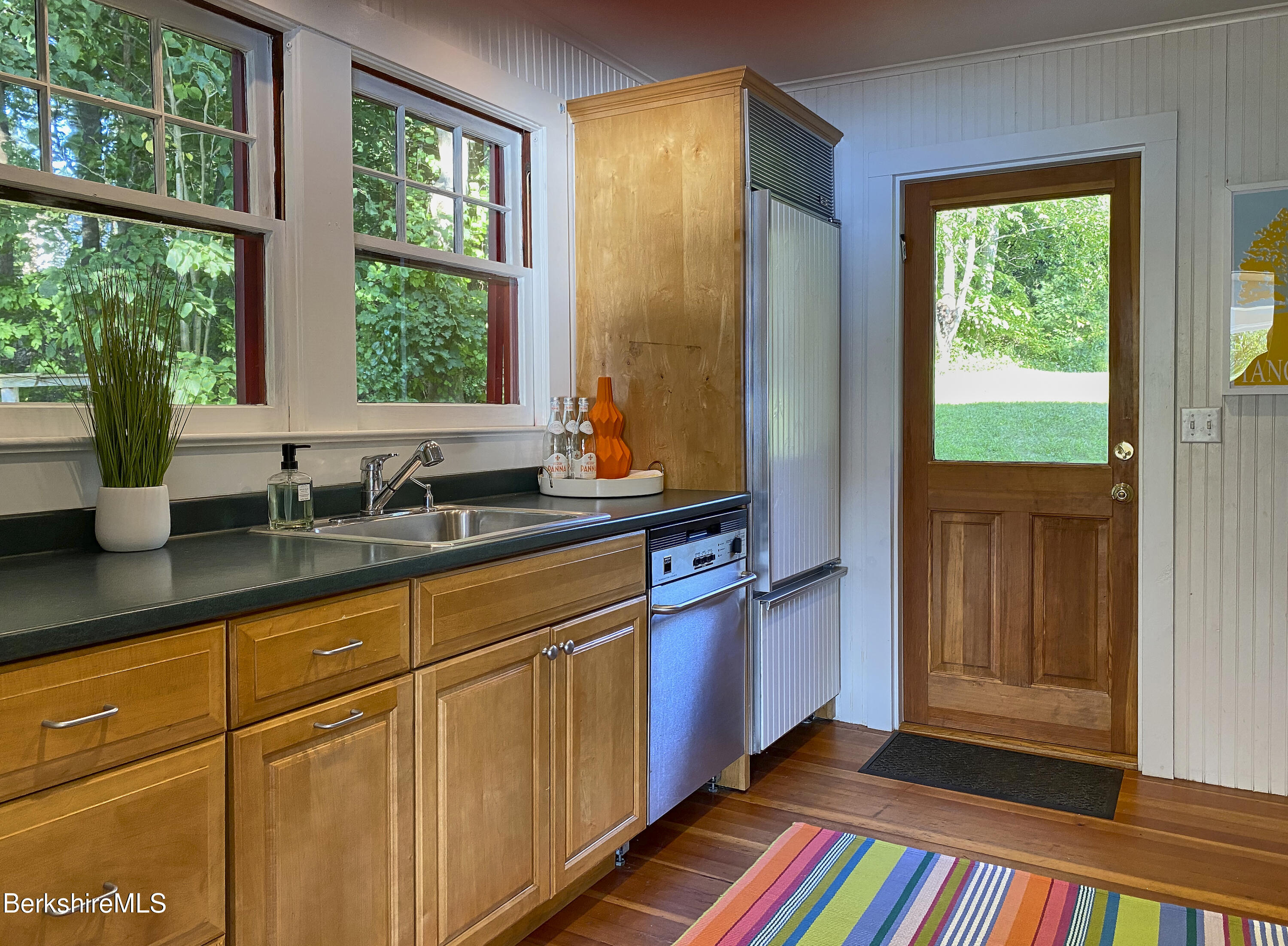 23 Mahkeenac Road Stockbridge, MA 01262 - Photo 14 of 37 a kitchen with stainless steel appliances sink and large window
