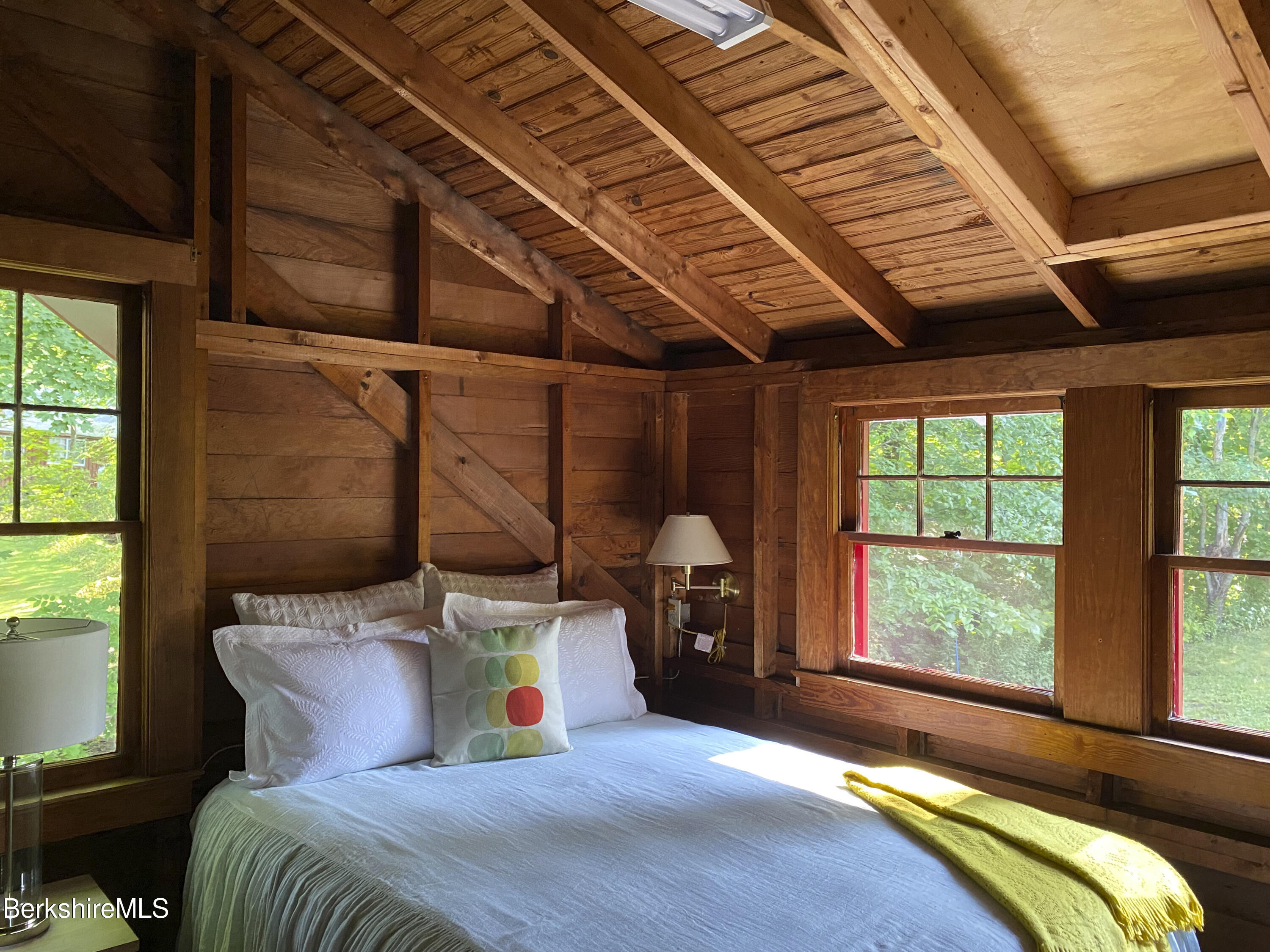 23 Mahkeenac Road Stockbridge, MA 01262 - Photo 24 of 37 a bed sitting in a bedroom next to a window
