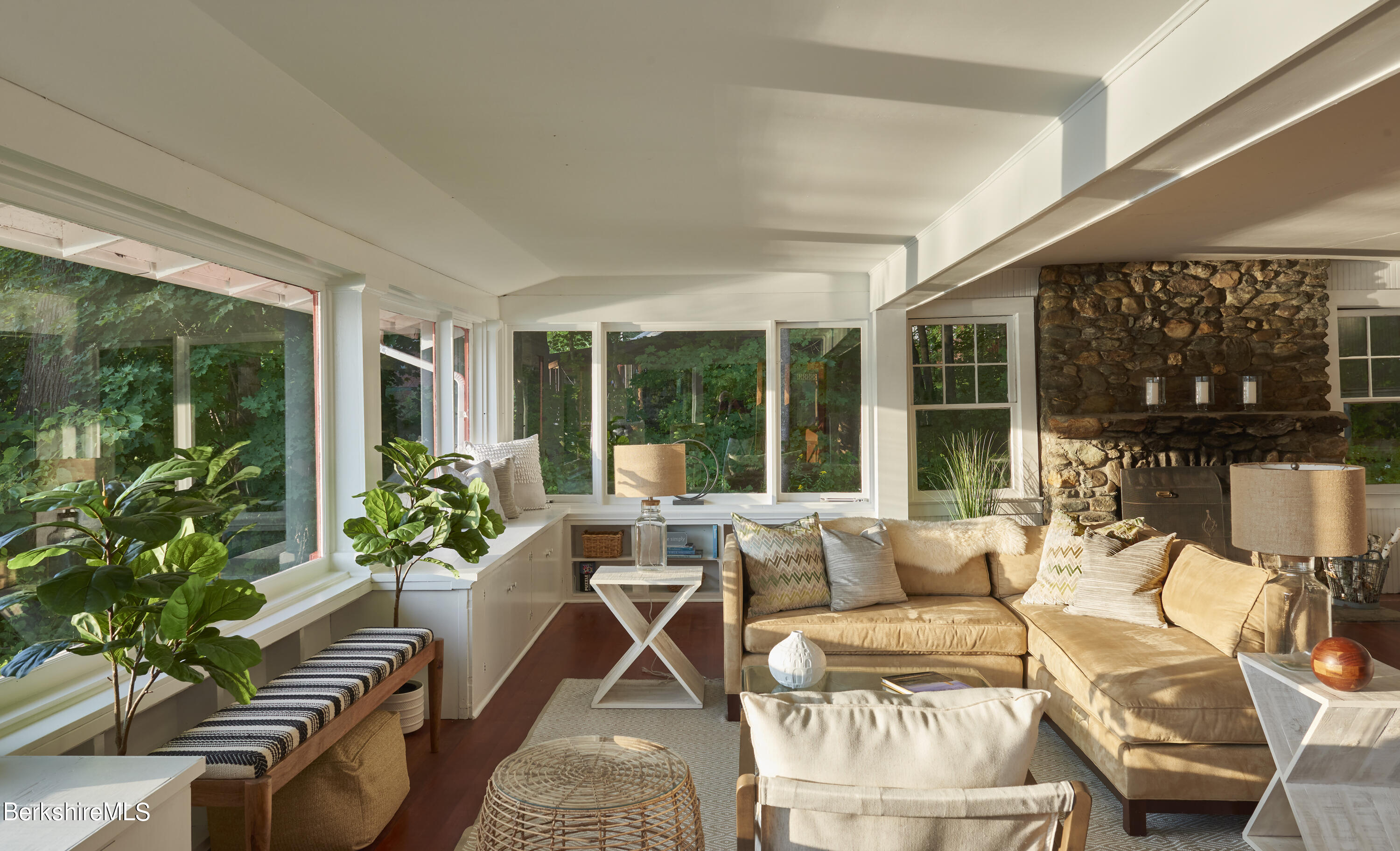 23 Mahkeenac Road Stockbridge, MA 01262 - Photo 10 of 37 a living room with patio furniture and potted plants