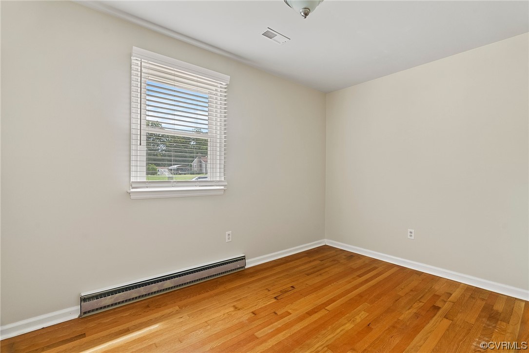 15418 Saddlebrook Road Chesterfield, VA 23838 - Photo 13 of 32 an empty room with wooden floor and windows