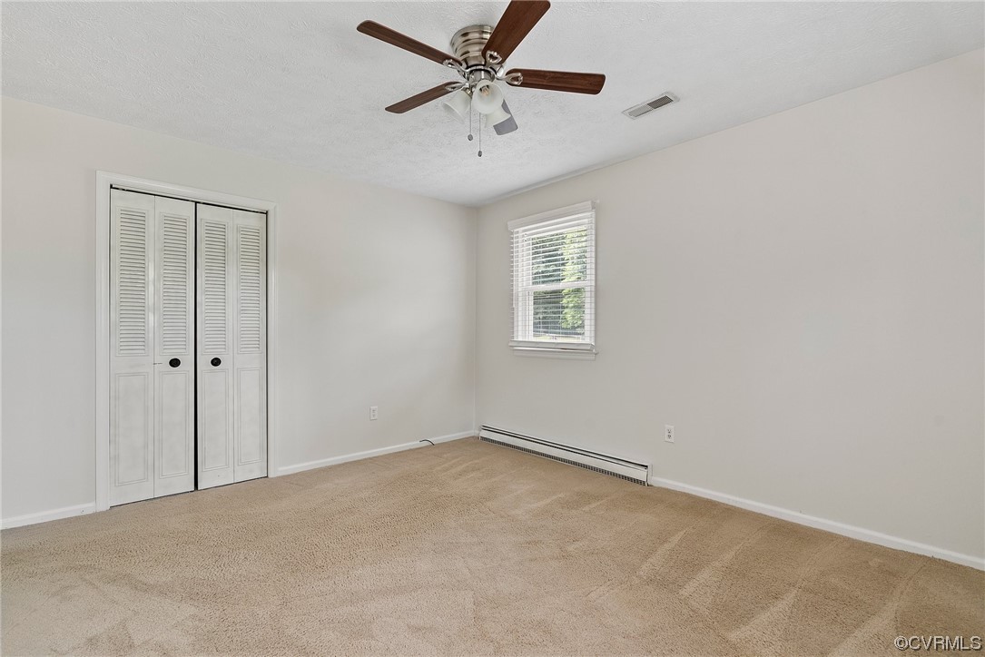 15418 Saddlebrook Road Chesterfield, VA 23838 - Photo 19 of 32 an empty room with windows and fan