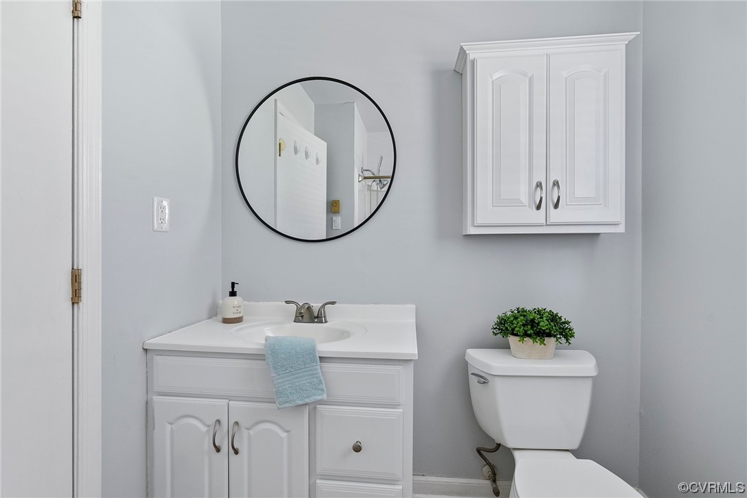 15418 Saddlebrook Road Chesterfield, VA 23838 - Photo 20 of 32 a bathroom with a toilet sink and mirror
