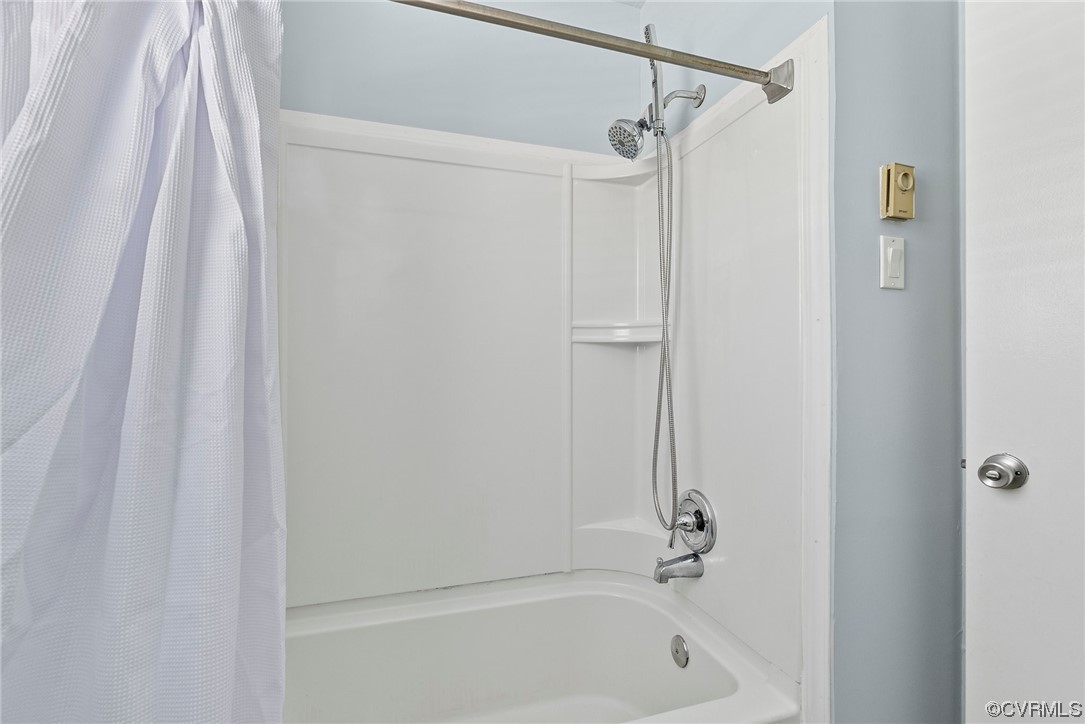 15418 Saddlebrook Road Chesterfield, VA 23838 - Photo 21 of 32 a bathroom with a shower and a bath tub