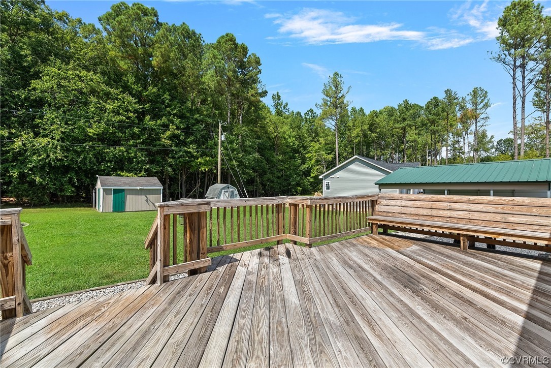 15418 Saddlebrook Road Chesterfield, VA 23838 - Photo 31 of 32 a view of a deck with a table and chairs a couches with wooden floor and fence