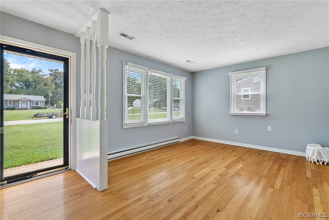 15418 Saddlebrook Road Chesterfield, VA 23838 - Photo 4 of 32 a view of an empty room with a window and a hardwood floor