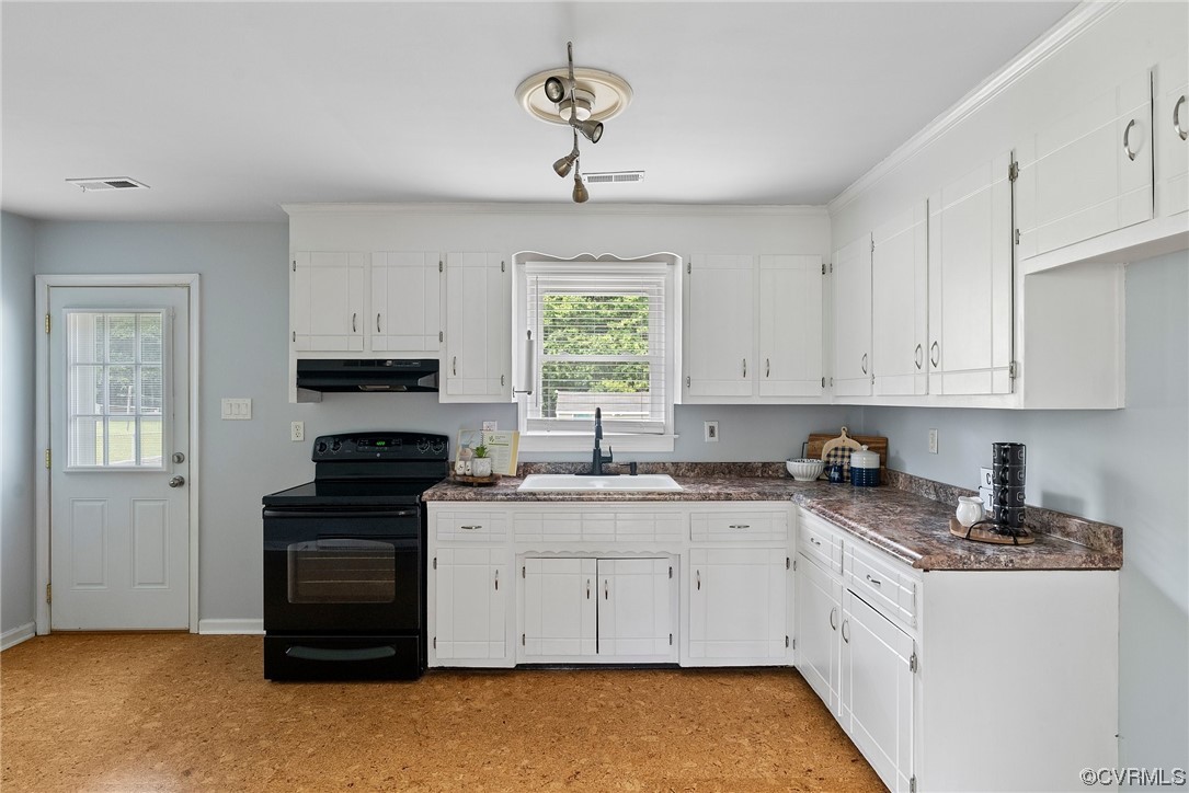 15418 Saddlebrook Road Chesterfield, VA 23838 - Photo 8 of 32 a kitchen with stainless steel appliances granite countertop white cabinets a stove a sink and a window