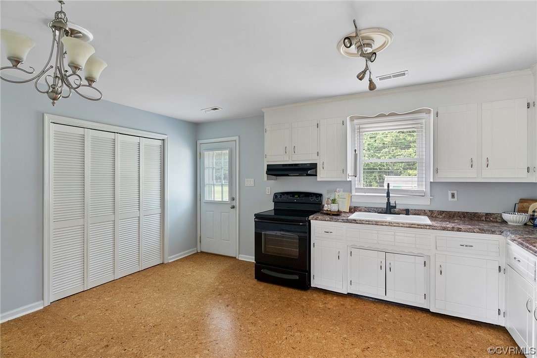 15418 Saddlebrook Road Chesterfield, VA 23838 - Photo 9 of 32 a kitchen that has a cabinets counter space appliances and a window
