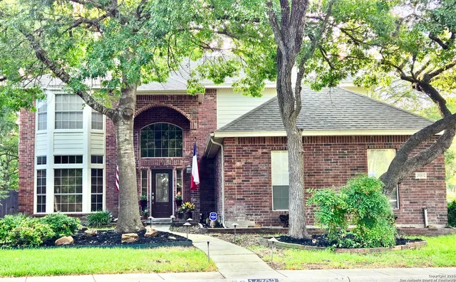a front view of a house with yard