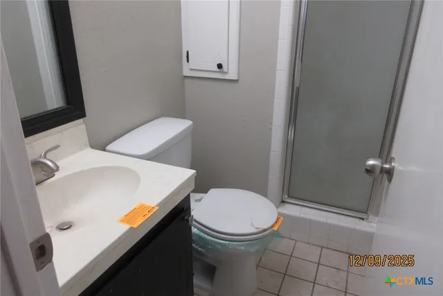 a bathroom with a toilet and a sink