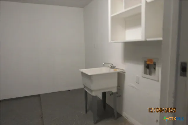 a bathroom with a sink and a window