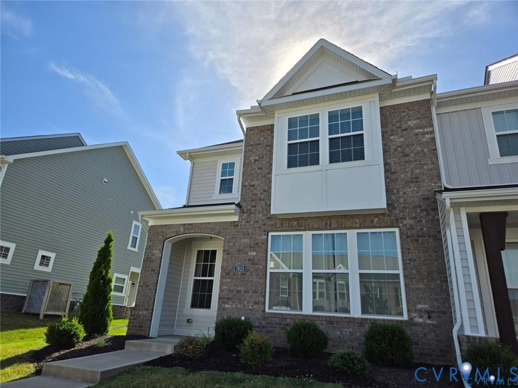7825 Old Guild Road Richmond, VA 23237 - Photo 2 of 27 Brick and siding exterior featuring a prominent ba