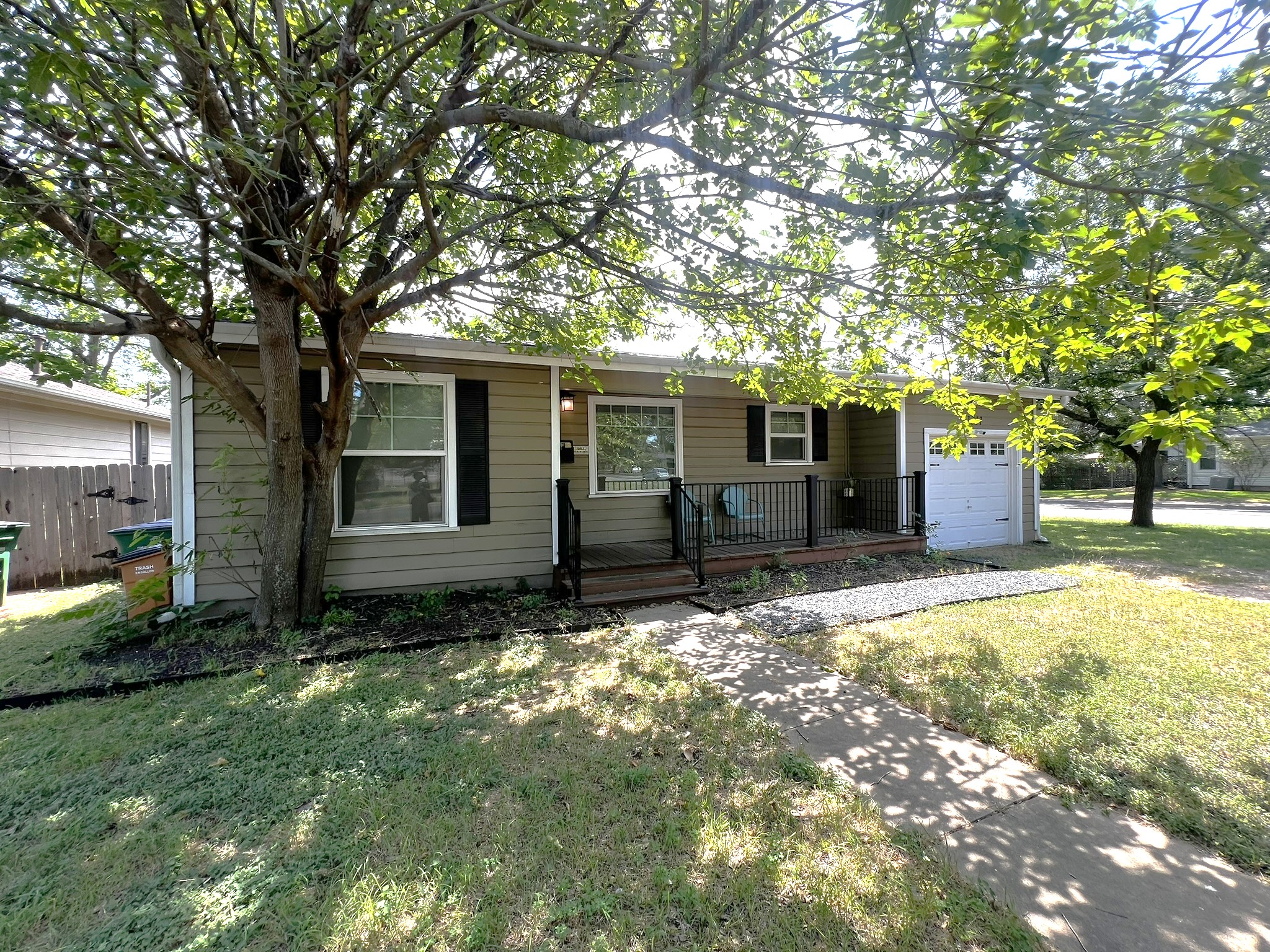1311 Aggie Lane, Unit A Austin, TX 78757 - Photo 13 of 13 View of front facade with a porch and an attached garage