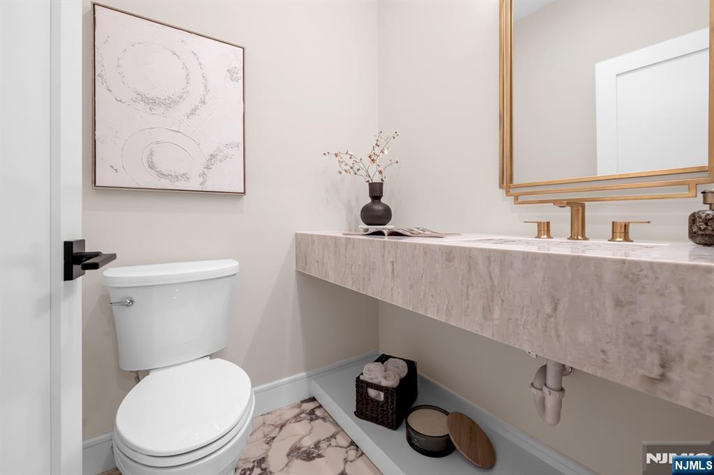 92 West Main Street Ramsey, NJ 07446 - Photo 13 of 47 a bathroom with a toilet and a sink