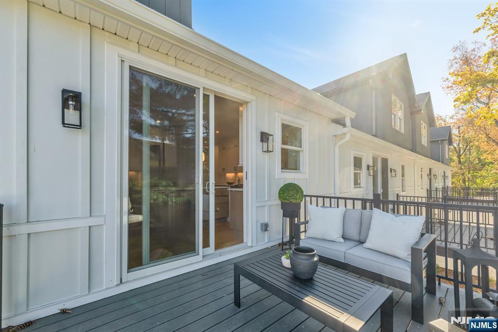 92 West Main Street Ramsey, NJ 07446 - Photo 14 of 47 a outdoor space with patio the couches and a dining table with balcony view