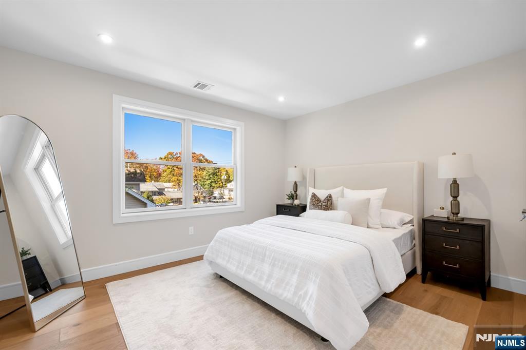 92 West Main Street Ramsey, NJ 07446 - Photo 27 of 47 a bedroom with a bed and a window