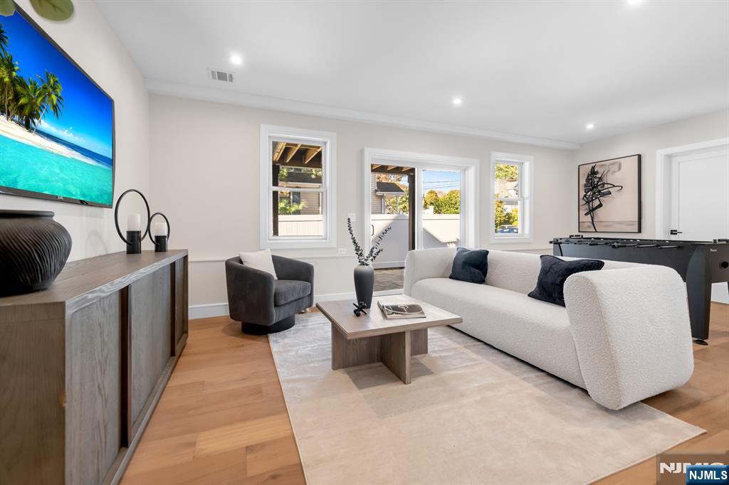 92 West Main Street Ramsey, NJ 07446 - Photo 40 of 47 a living room with furniture fireplace and window