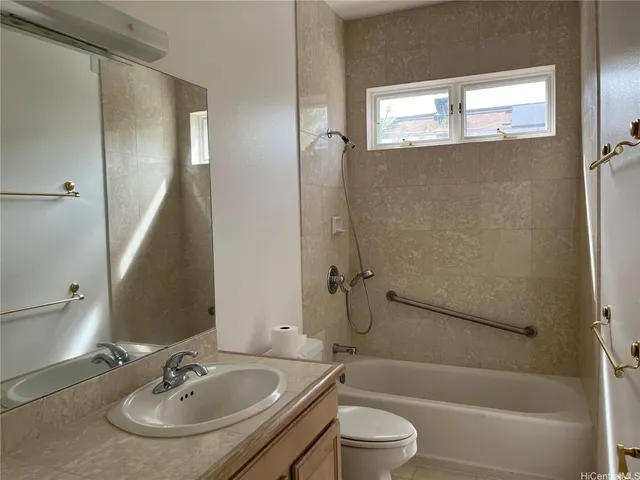 a bathroom with a sink a toilet and a bathtub
