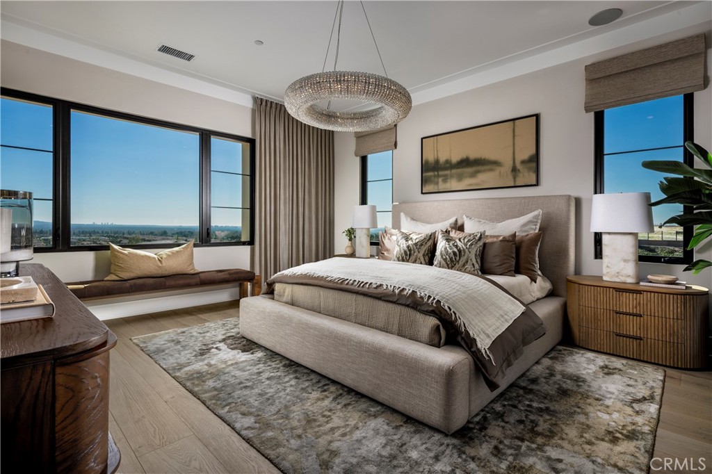 552 Peninsula Irvine, CA 92602 - Photo 13 of 19 a bedroom with a large bed and a couch