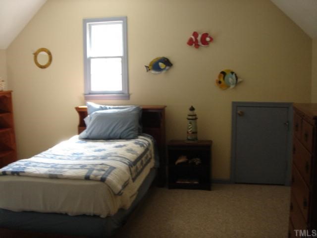5408 Fieldstone Drive Raleigh, NC 27609 - Photo 6 of 10 a bedroom with a bed and a window