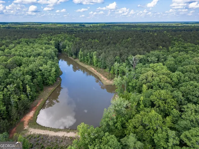 a view of a lake with a yard