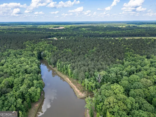 a view of a lake with a yard
