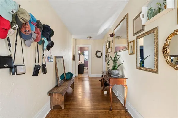 a view of a livingroom with furniture and a flat screen tv