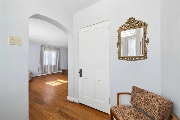 a view of livingroom with hardwood floor and hallway
