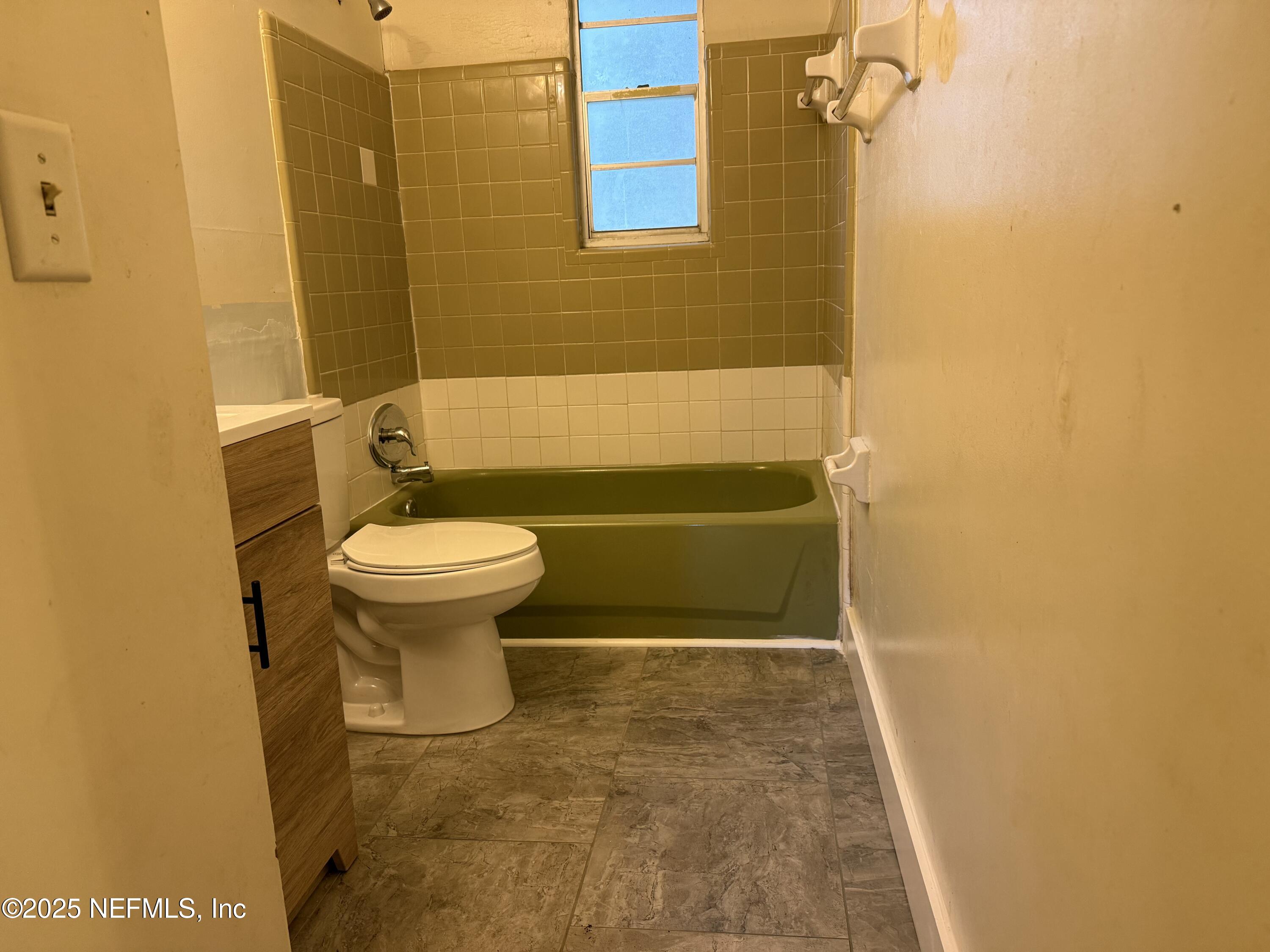 679 James Court Macclenny, FL 32063 - Photo 13 of 17 a bathroom with a sink and a toilet