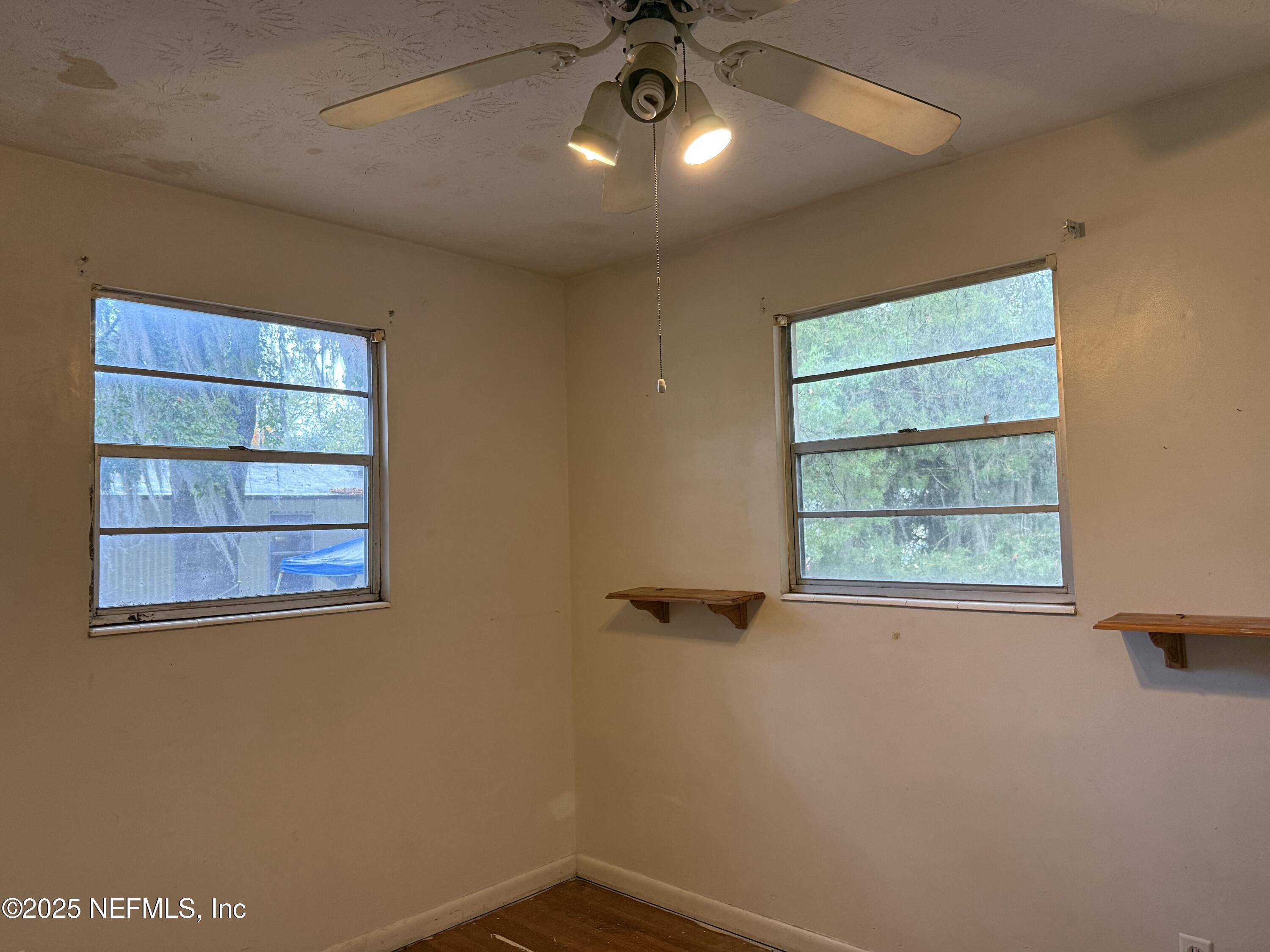 679 James Court Macclenny, FL 32063 - Photo 14 of 17 an empty room with a window