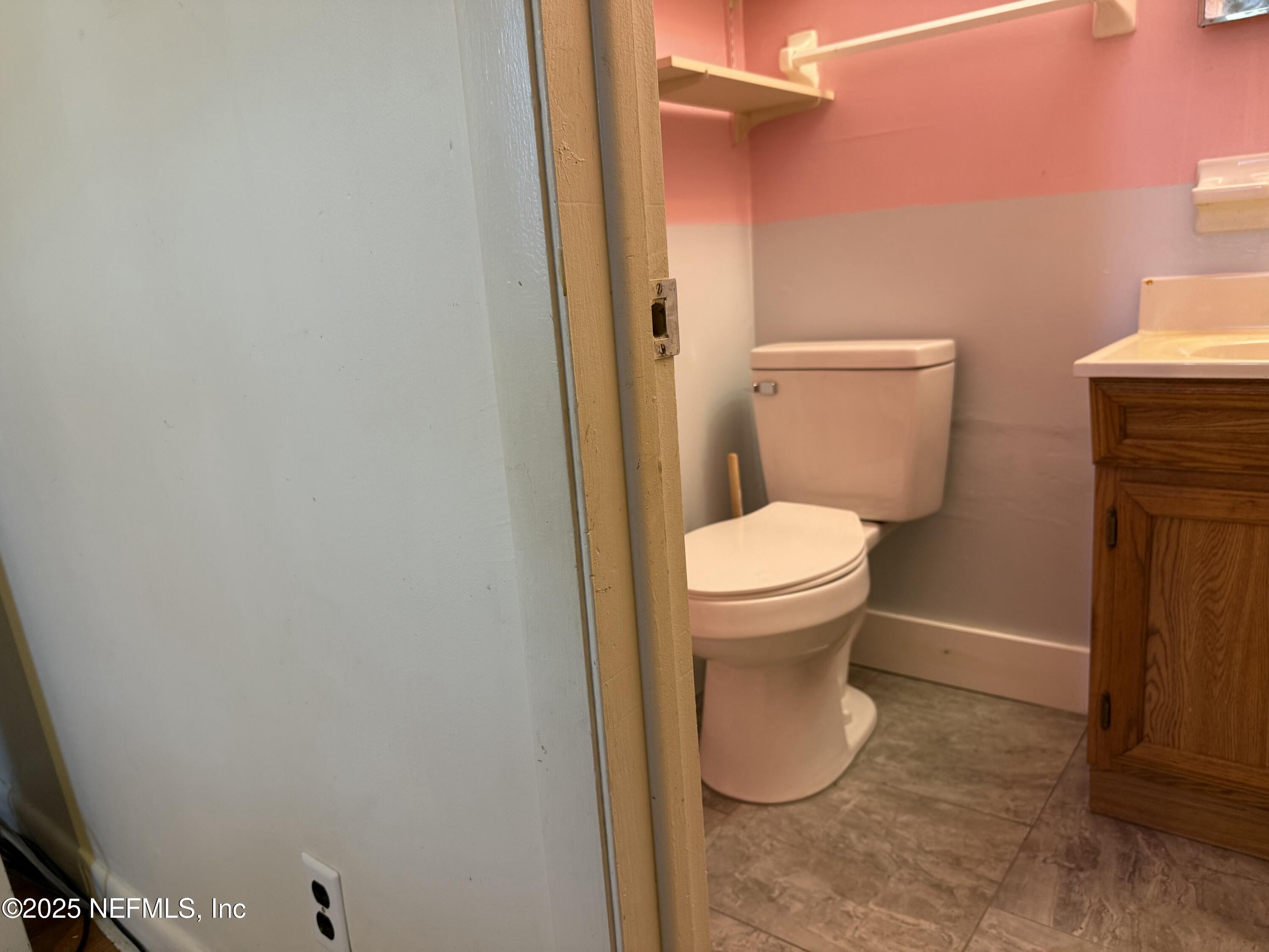679 James Court Macclenny, FL 32063 - Photo 16 of 17 a bathroom with a toilet and a sink
