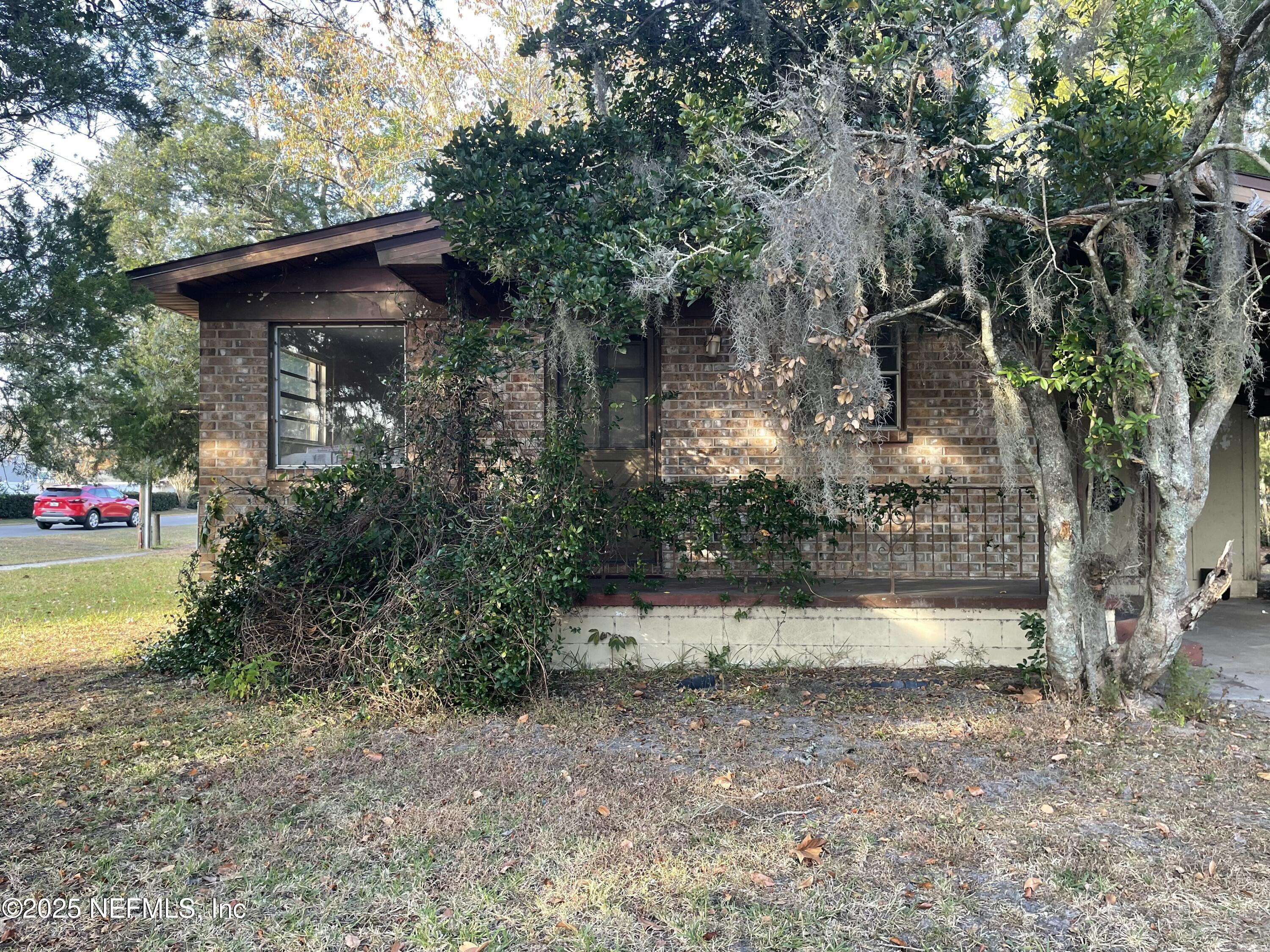 679 James Court Macclenny, FL 32063 - Photo 6 of 17 a front view of a house with garden
