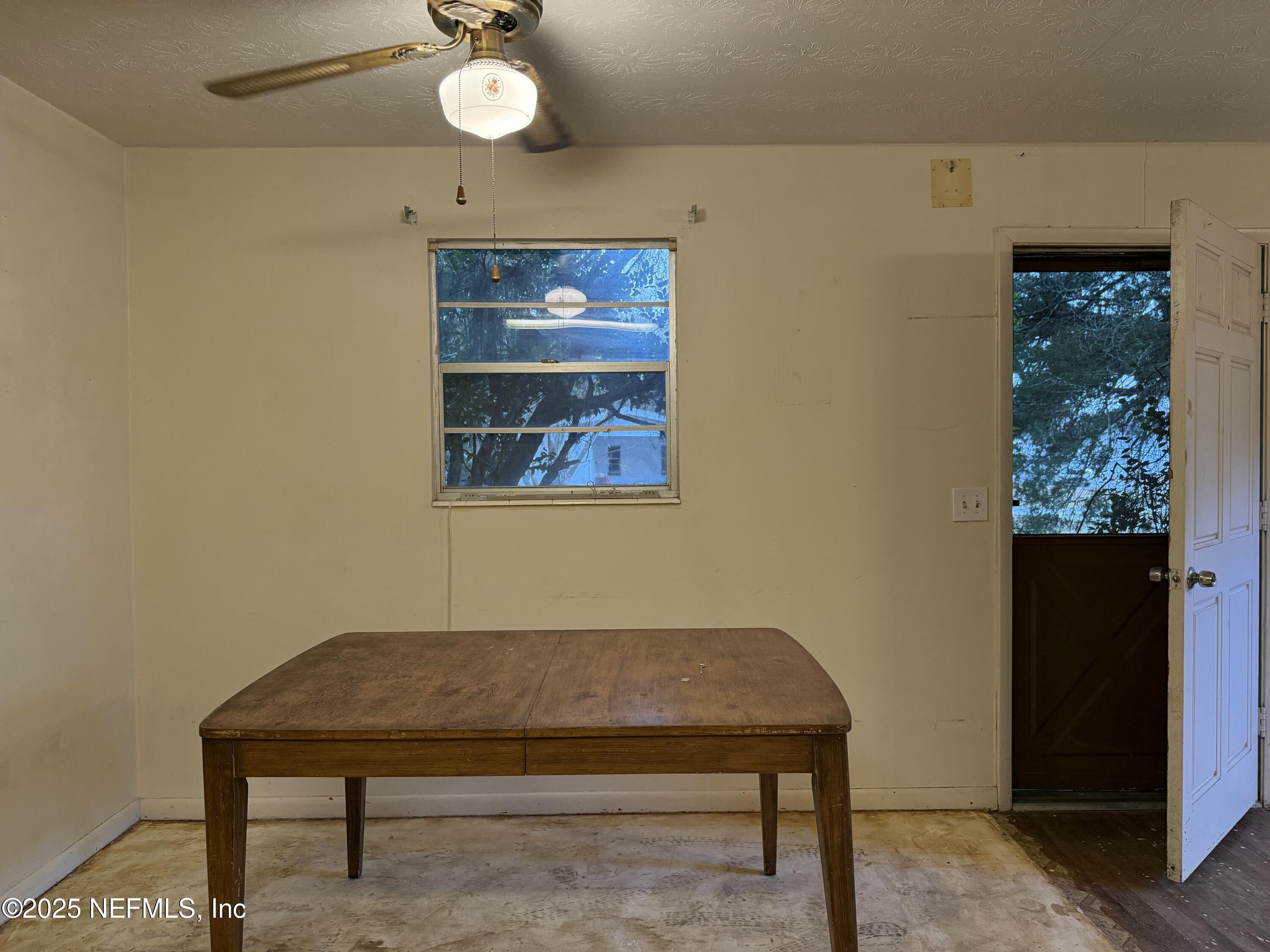 679 James Court Macclenny, FL 32063 - Photo 8 of 17 a view of a room with a potted plant and wooden floor