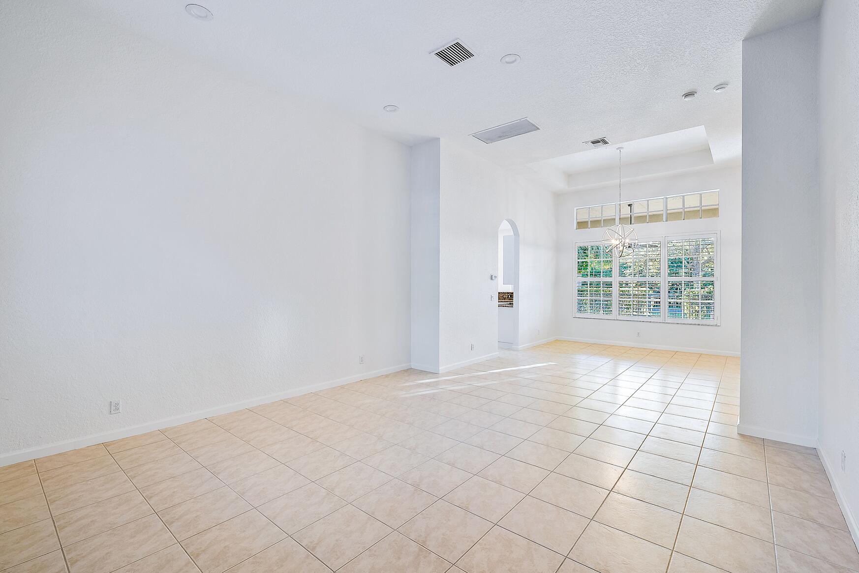 116 Via Rosina Jupiter, FL 33458 - Photo 13 of 33 en empty room with windows